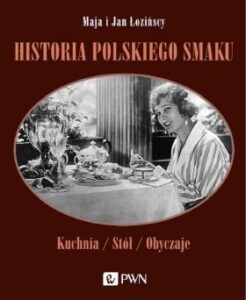 Okładka książki: Historia polskiego smaku" ze starym zdjęciem kobiety siedzącej przy zastawionym stole.