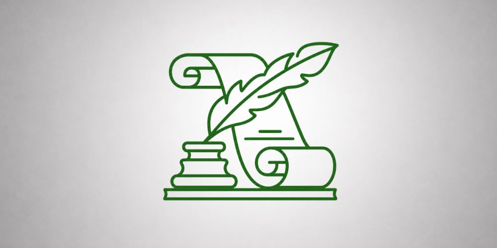 Zielony zwój obok kałamarza z piórem.